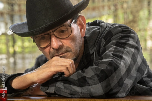 Fototapeta Portrait of an elderly man with a hat: active retired lifestyle