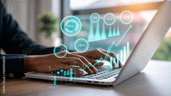 Fototapeta Dynamic financial analytics visualized on laptop, empowering business growth and data-driven decisions.