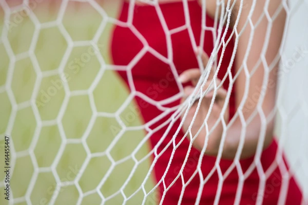 Obraz The girl behide the Goal Nets.Select focus.