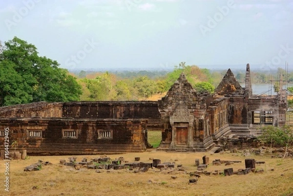 Obraz Ancient stone temple ruins at Wat Phu in Champasak, Laos, surrounded by lush greenery