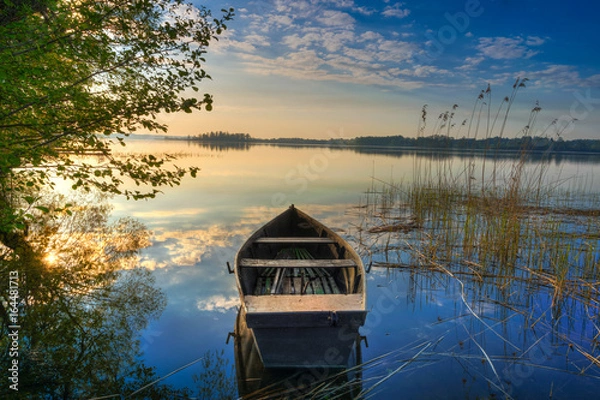Fototapeta Rowing boat floating over the Lake Selment Wielki waters. Masuria, Poland.