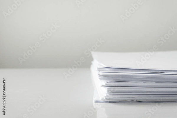 Fototapeta blank papers on white table,blank stack documents paper on office desk.