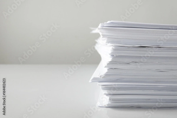Fototapeta blank papers on white table,blank stack documents paper on office desk.