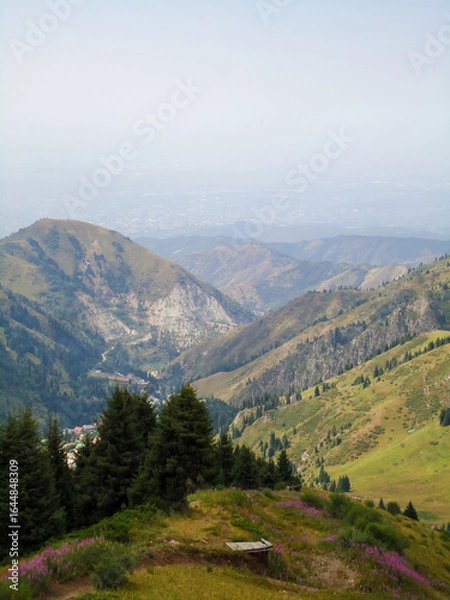 Fototapeta Panoramic view of the city of Almaty, opening from the mountain resort Shymbulak, Kazakhstan