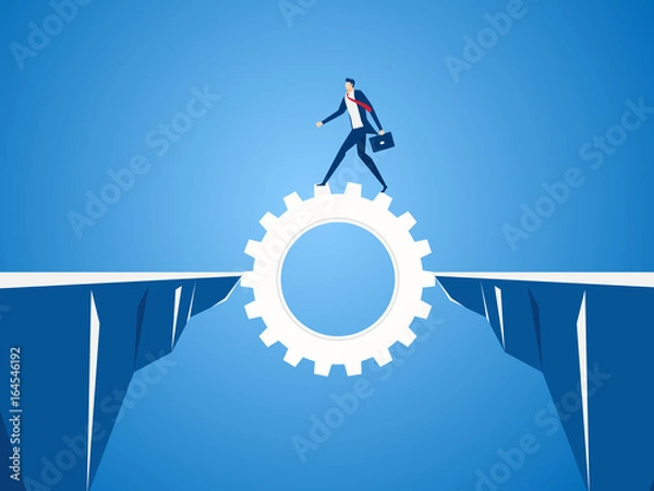 Fototapeta Businessman using cog gear to cross through the gap between hill.  Business risk and success concept.