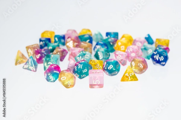 Obraz different colours dices for fantasy dnd and rpg tabletop games. Board game polyhedral dices with different sides isolated on white background