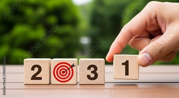 Fototapeta New year goals planning concept setting up wooden blocks for year twenty twenty one