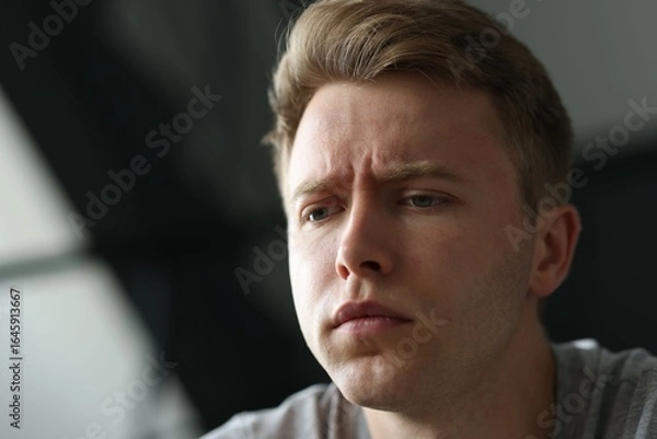 Fototapeta Sad man on blurred background, space for text. Depression