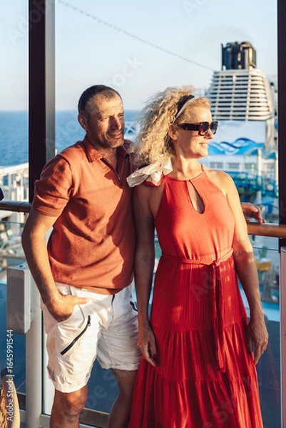 Obraz Married couple on cruise ship. Attractive couple on deck with cruise ship. Vertical photo. High quality photo
