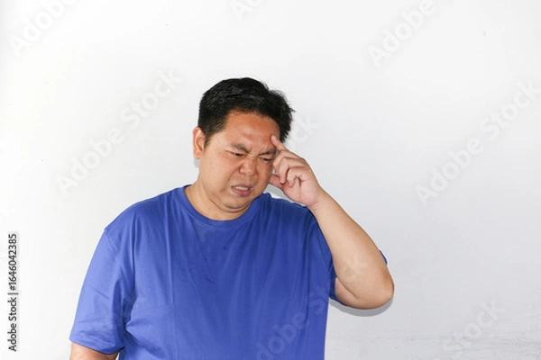 Fototapeta Portrait of asian guy with hard thinking gesture, considering something important