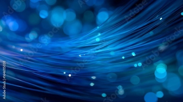 Fototapeta Wavy blue optic fibers flowing with bokeh background, conveying fast data transfer