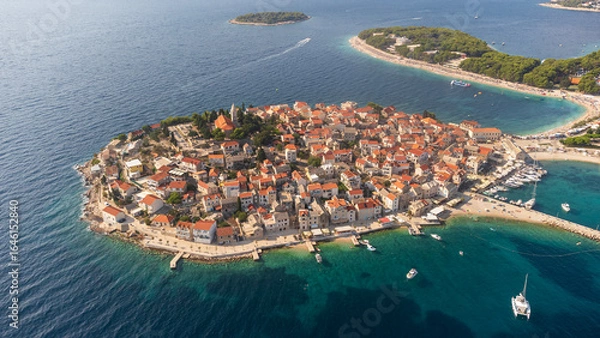 Obraz Aerial panorama of the tourist town of Primosten in Croatia. Aerial view of the landscape with the village and the Croatian Adriatic coast in summer