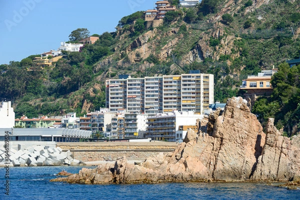 Fototapeta View towards Blanes port with rock on foreground, Catalonia, Spain.