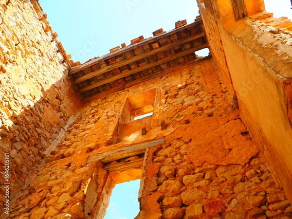 Obraz Requena,19th century telegraph tower in Mediterranean countryside, historic communication building under bright blue sky 