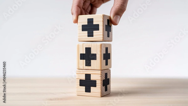 Fototapeta Building positive momentum with stacked wooden blocks featuring prominent plus signs