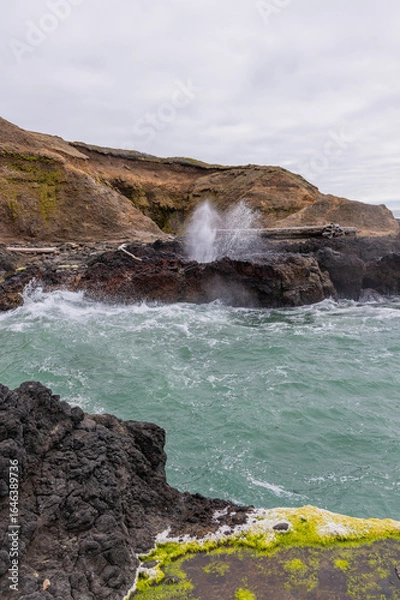 Obraz Cliffs with water spouting up from ocean