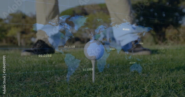 Fototapeta White golf ball sitting on tee at golf course, with world map overlay and golfer outfit