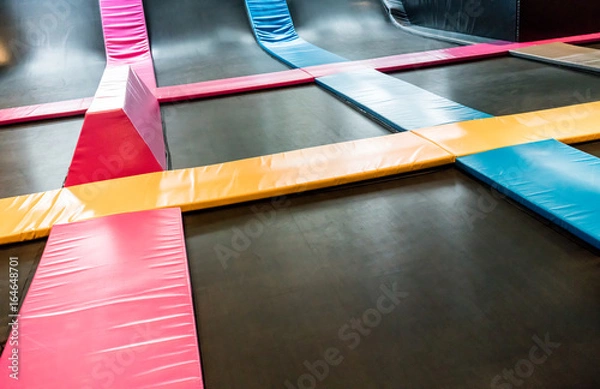 Fototapeta Interconnected trampolines for indoor jumping
