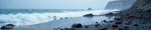 Obraz Bleak Beauty Icy Waves Crashing on a Rugged Winter Coastline at Low Tide, Revealing Dark Textured Rocks and Frozen Pools Under an Overcast Sky