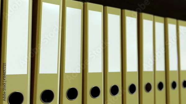 Fototapeta Yellow office binders. 3D rendering