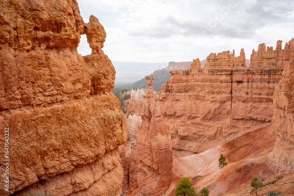 Fototapeta View of rocks in Bryce Canyon National Park, Queens Garden Trail, Utah, USA. View of red and orange sharp rock needles.	
