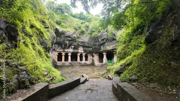 Obraz Majestic Exterior of Elephanta Caves with Massive Columns in Monsoon Greenery