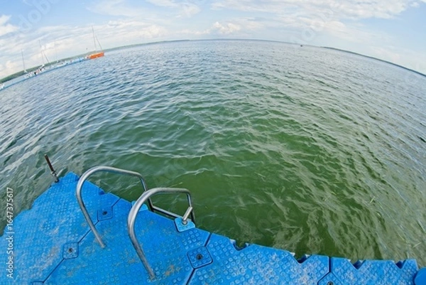 Fototapeta Lake Narach, Belarus, July 16, 2025. A place for swimming.                               