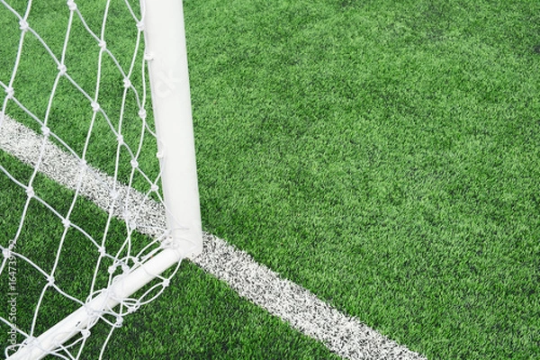 Obraz close up of mesh football goal with Artificial turf on  for sport background.
