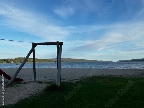 Fototapeta empty swing on the beach