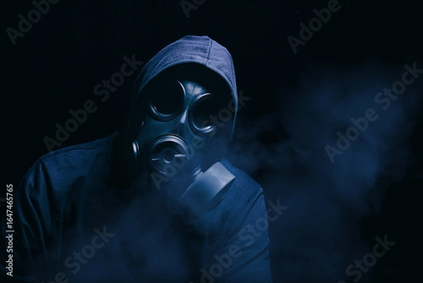 Obraz Man with hoody being protected by a gasmask