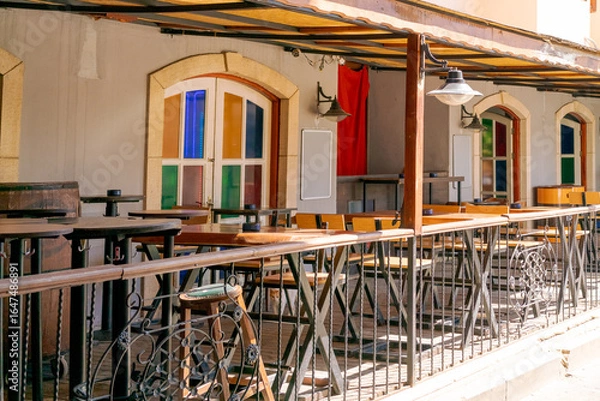 Obraz Patio with a railing and tables