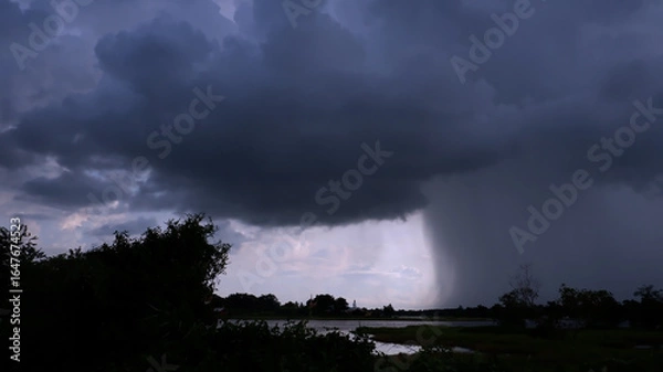 Fototapeta Rain clouds and black sky textured background. Danger storm cloud, Black cloud and thunder storm, Dark sky and motion clouds before rainy