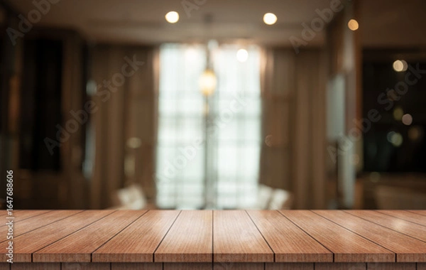 Fototapeta Empty wooden table top with lights bokeh on blur restaurant background.