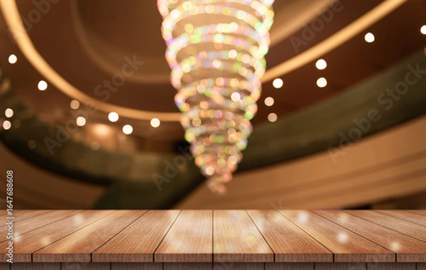 Fototapeta Empty wooden table top with lights bokeh on blur restaurant background.