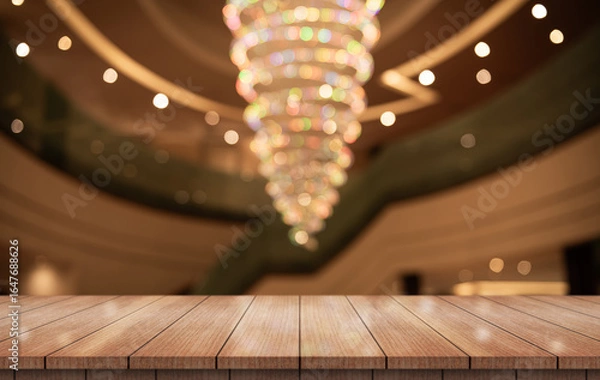 Fototapeta Empty wooden table top with lights bokeh on blur restaurant background.