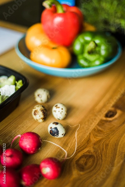 Obraz Fresh raw quail eggs on wooden table.