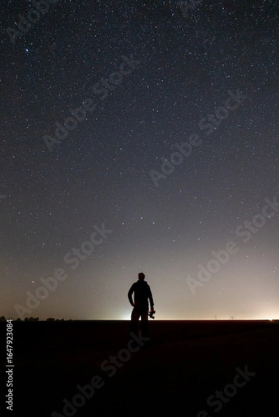 Obraz Sternhimmel mit einer Person als Silhouette