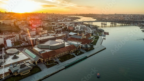 Fototapeta Aerial drone view of Halic Congress Center in Istanbul, modern architecture surrounded by cityscape and waterfront.