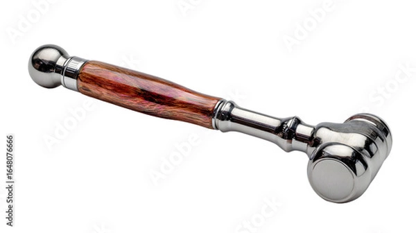 Fototapeta A gavel with a wooden handle and a shiny silver head sitting on a black background in a studio shot