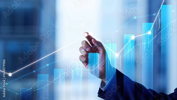 Fototapeta Visualizing Financial Growth A Hand Pointing at Rising Bar Graphs and Lines on a Blue Background Representing Market Trends and Economic Development with Clarity and Insight