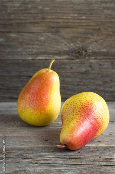 Fototapeta Pears on a wooden table.
