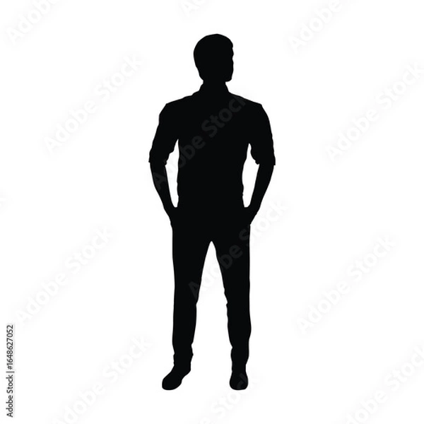 Fototapeta Silhouette of a man standing with his hands casually in his pockets and wearing a collared shirt with the sleeves rolled up.