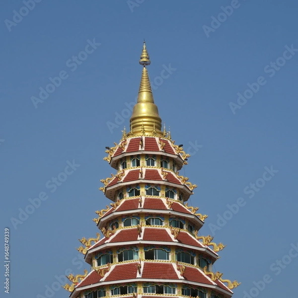 Fototapeta Wat Huay Pla Kang,Figures and houses at the giant white buddha in Chiang Rai, Thailand