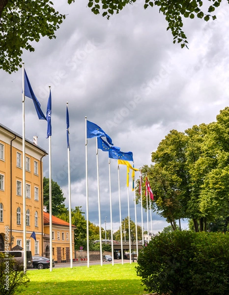 Obraz Historic district in center of old Riga with waiving flags of Latvia, European Union and Ukraine