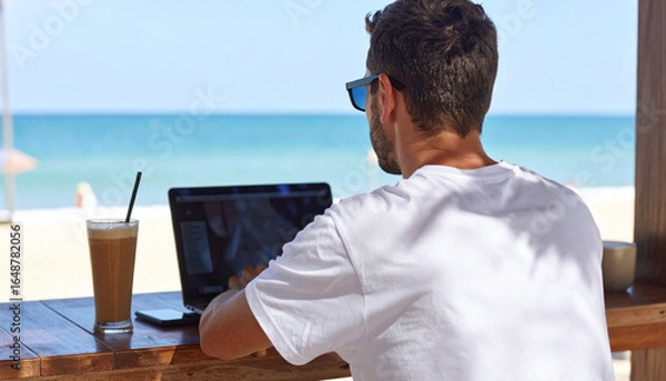 Obraz Digital Nomad Working Remotely at Tropical Beach Cafe