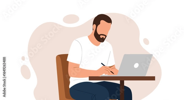 Fototapeta Focused bearded man working on a laptop and writing notes in a modern casual setting, illustrating remote work and productivity.