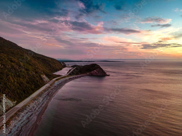 Fototapeta winding road through the forest . View from top of a cliff. Nova scotia canada.