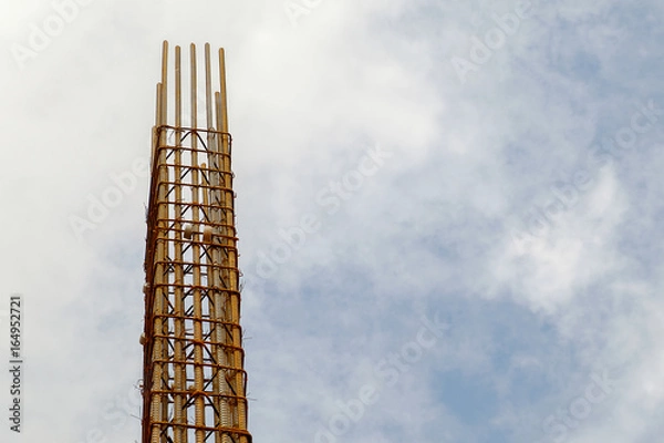 Fototapeta reinforce concrete column construction with sky background
