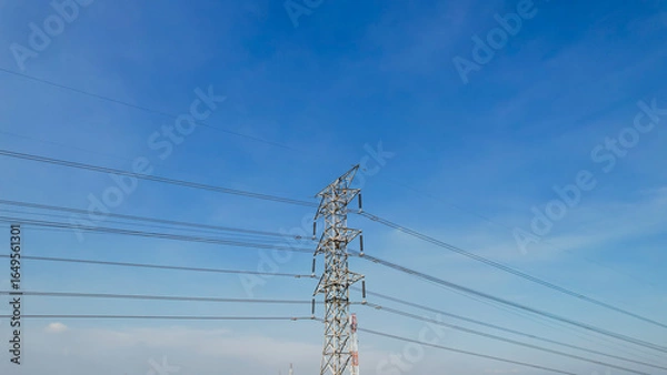 Fototapeta High voltage electric pole power line electric transmission tower, technology energy clean ecosystem change green environment, substation construction pylon generator grid electricity.