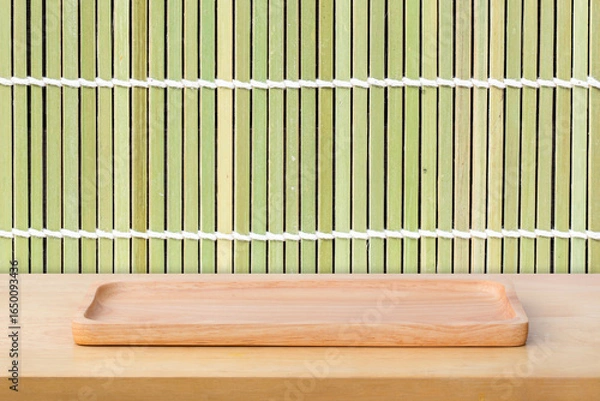 Obraz Empty sushi board on wood table with bamboo background. Top view of plank wood for graphic stand product, interior design or montage display your product.